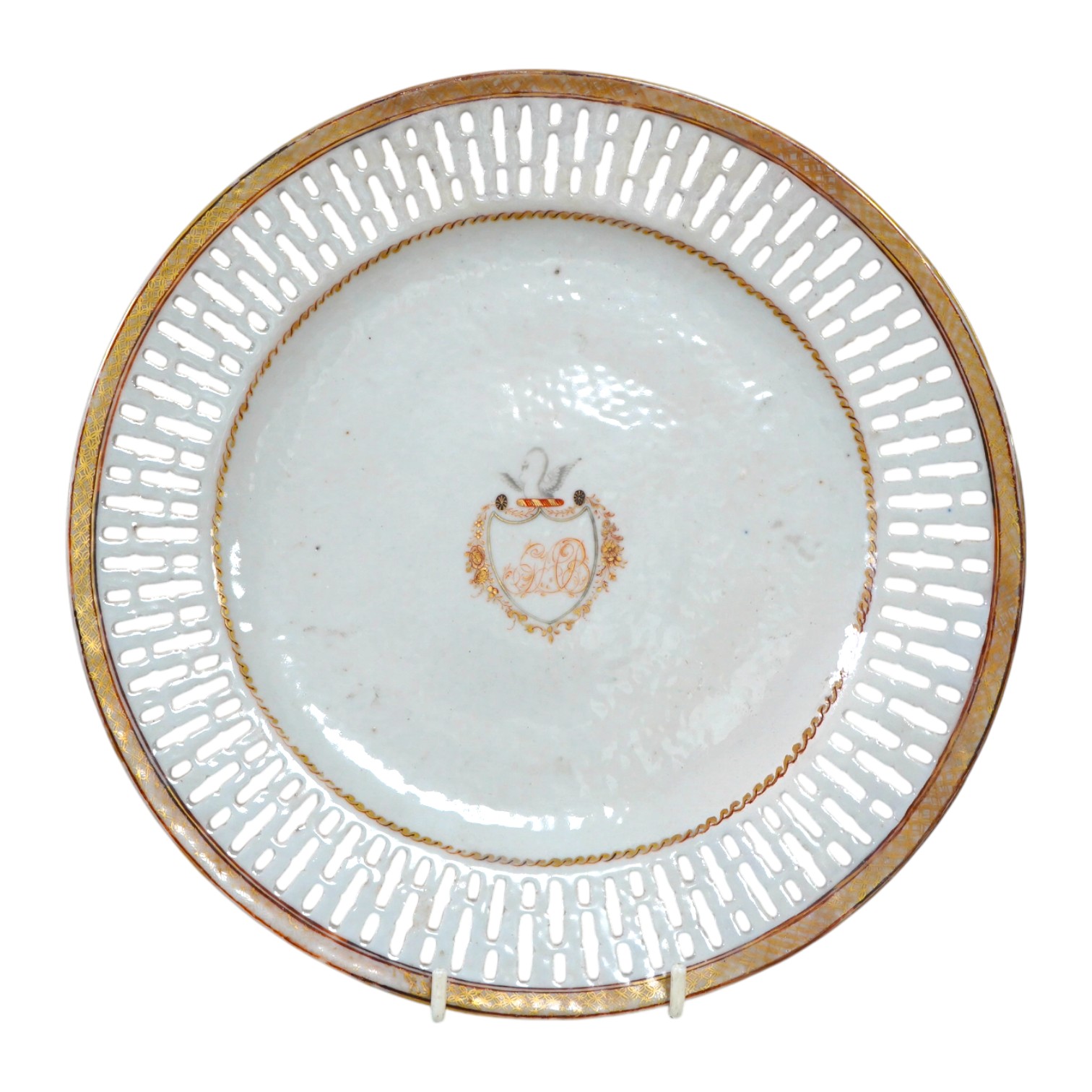 A Chinese pierced and armorial crested porcelain dish, Qianlong, 24.5cm diameter. Condition - a little worn